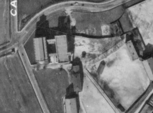 Aerial View Of St. Mary's Circa 1927, Showing Chapel and Four Story Stone Building Fronting Wilkins Avenue (Maryland Port Administration Aerial Photo - image located at jscholarship.library.jhu.edu)